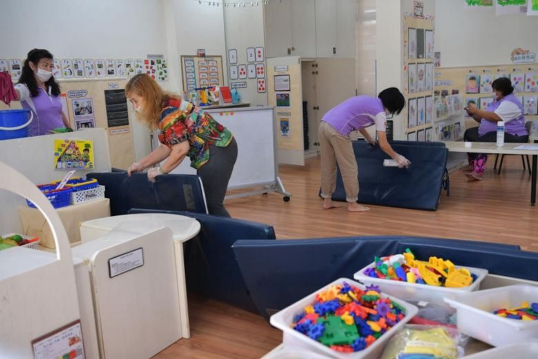 Staff cleaning the Nursery 2 classroom at a PAP Community Foundation Sparkletots pre-school at Block 305 Clementi Avenue 4 yesterday.