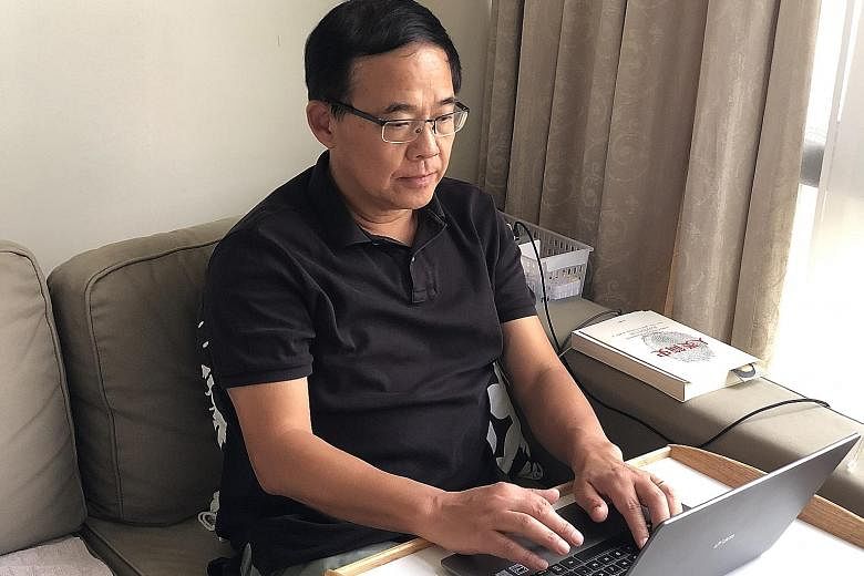 Professor Wang Linfa, director of the emerging infectious diseases programme at Duke-NUS Medical School, working at home while on self-imposed home quarantine after a visit to Wuhan, China.