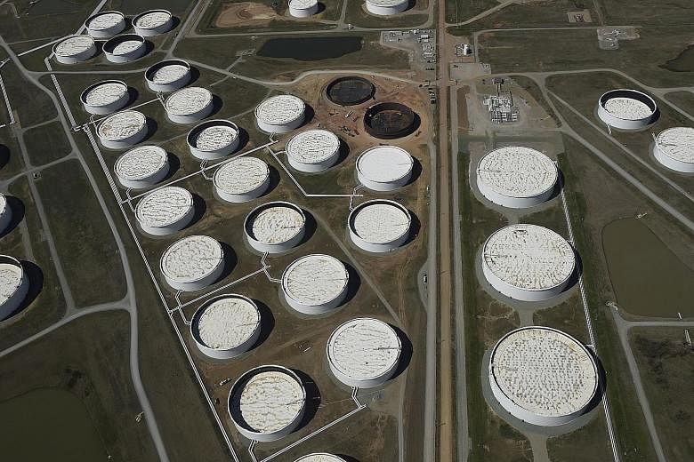 Crude oil storage tanks in Cushing, Oklahoma, in the United States. IHS Markit said current rates of supply and demand globally mean inventories will increase by 1.8 billion barrels over the first half of this year - while there is only an estimated 