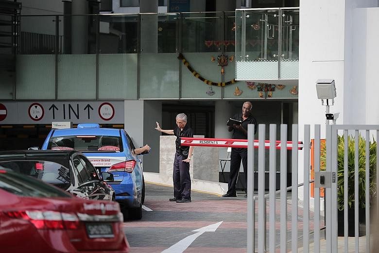 Security officers manning the entrance at Eight Riversuites condominium in November. Outrage was sparked last Deepavali, when a resident was caught on camera verbally abusing a security guard. ST FILE PHOTO