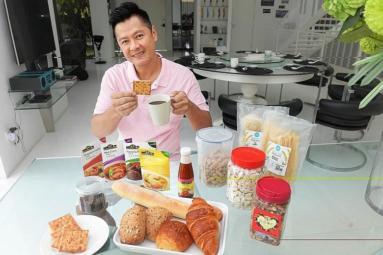 Actor Li Nanxing's (above) cabinets are packed with brown rice, organic noodles, sauces, canned food, spice mixes and his favourite snack: cream crackers.