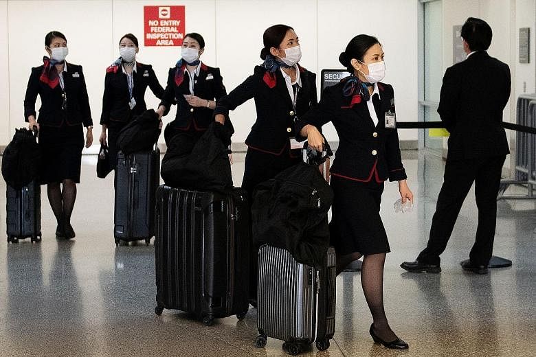 From April, nearly 6,000 female crew members of Japan Airlines will be able to choose footwear that "best fits their needs", with or without heels, the airline has said. PHOTO: REUTERS