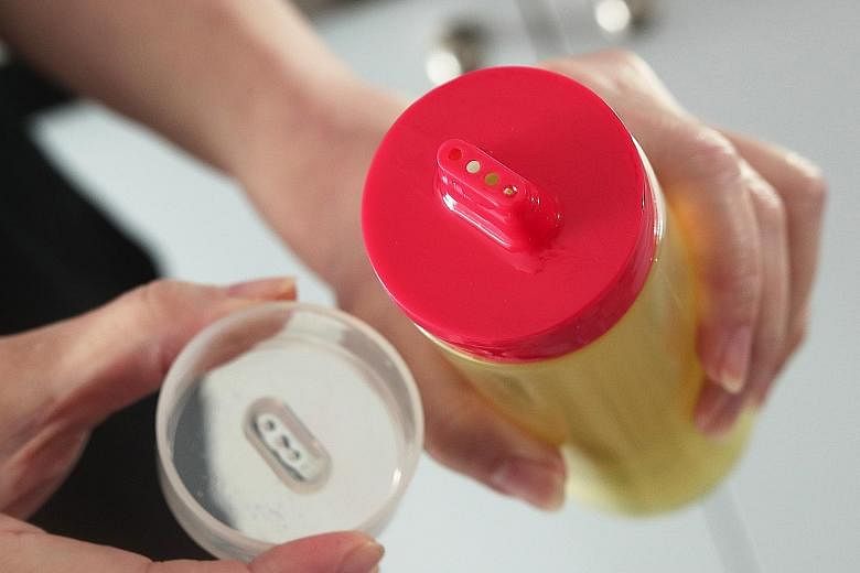 Use a squeeze bottle with small nozzles for cooking oil, so you never pour too much into a pan. An inexpensive lazy Susan makes it easy to spin and grab condiments for cooking. The writer with her pantry after purging and reorganising it. If you can,