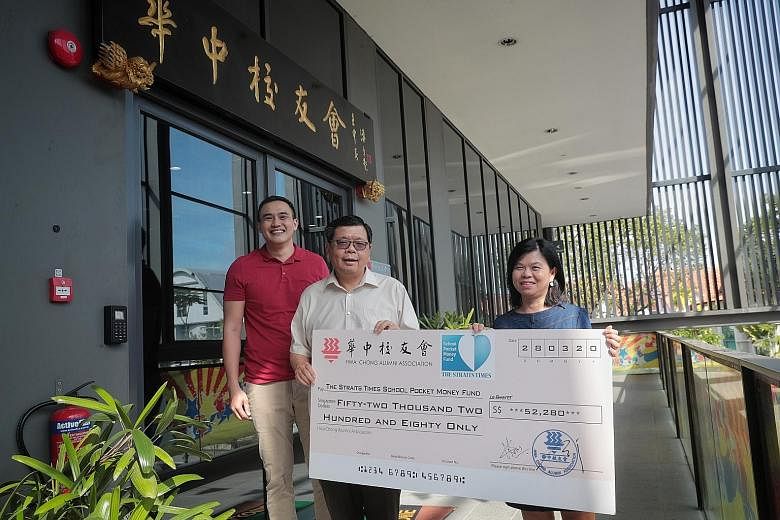 (From left) Hwa Chong Alumni Association's deputy president Chia Min Chong and president Jimmy Ng Leng Kim with the cheque for $52,280 presented to the ST fund's general manager Tan Bee Heong yesterday. ST PHOTO: JASON QUAH