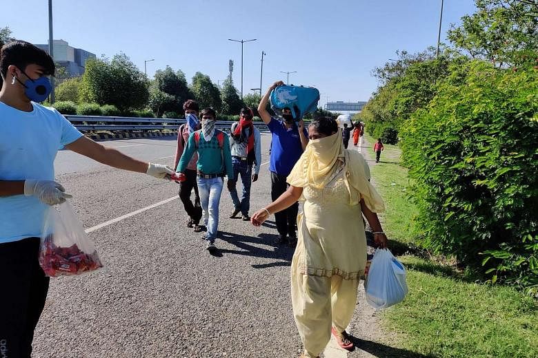 Mr Vijay Singh, 24, and his family on their way home last Saturday. They had left their shanty in Noida in the morning and were still nearly 500km away from their home in Mahoba in Uttar Pradesh.
