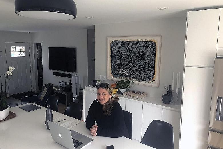 Regional sales manager Catherine Minervini holds her video-chats in her kitchen in her New Jersey home.