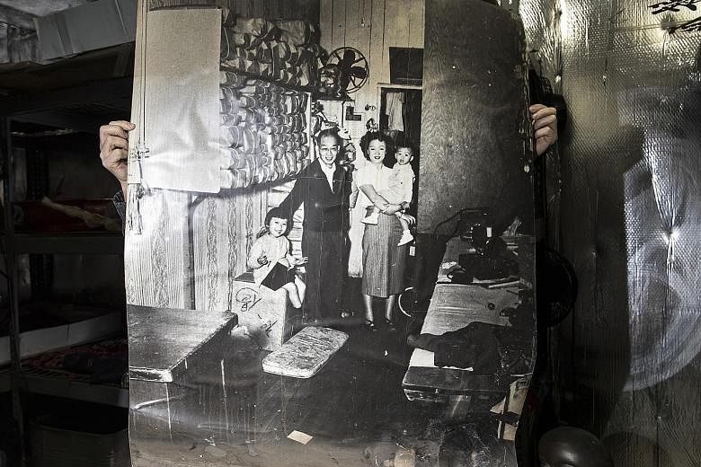 This poster-size photo of the Chin family in Sam Wah Laundry in the Bronx in 1952 was rescued after a fire broke out at the Museum of Chinese in America.