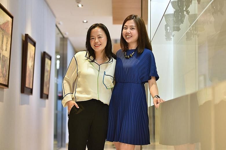 Ms Kay Choi (far left), who is from South Korea, and her Singaporean colleague, Ms April Ho, in the Citi Singapore office. The two women have struck up a friendship outside of work.