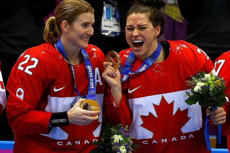 Hayley Wickenheiser (left, with Canada ice hockey teammate Natalie Spooner at the 2014 Sochi Olympics) was one of the fierce critics of the IOC. PHOTO: REUTERS