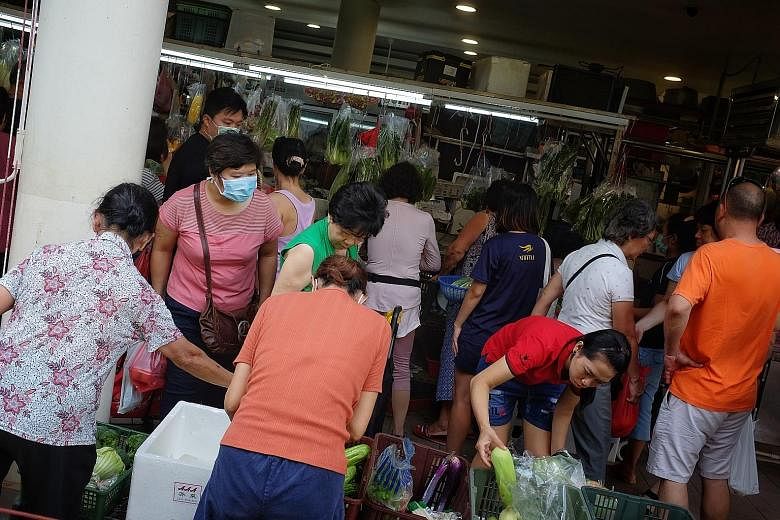 Customers at Tiong Bahru Market last Saturday. Markings will be drawn on the floor at markets to remind people to keep a safe distance from one another. ST PHOTO: JASON QUAH
