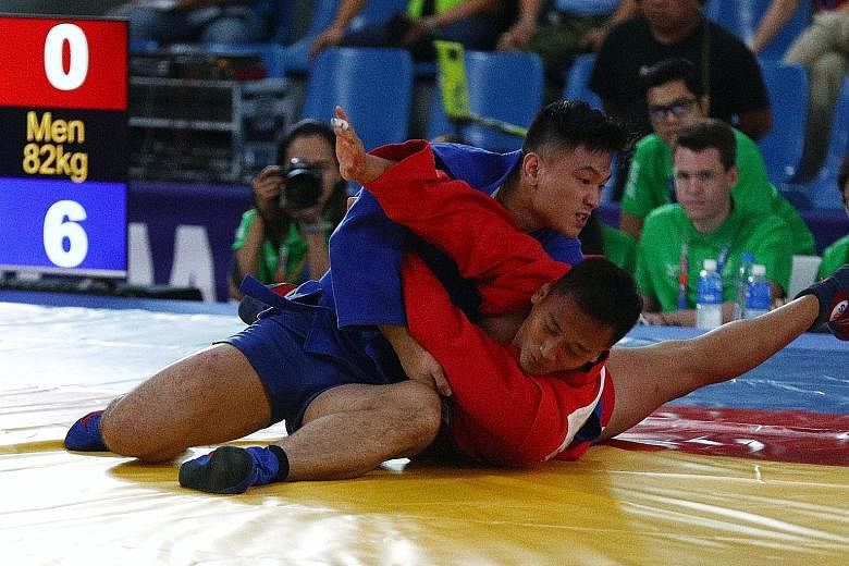 Gary Chow competing at last year's SEA Games in the sambo 82kg event. The Singaporean, who won silver in the Philippines, had pulled out of the judo squad for the Games. LIANHE ZAOBAO FILE PHOTO