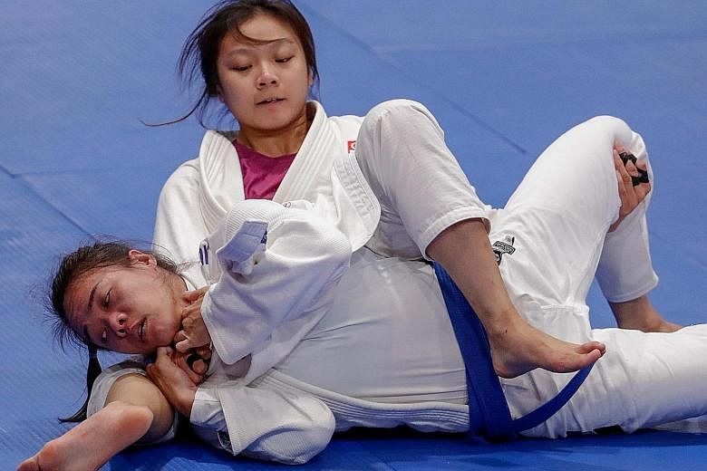 Constance Lien proving too strong for Vietnam's Nguyen Ngoc Tu in the ne-waza Under-62kg final last year, clinching her first SEA Games gold medal. The Singaporean is one of 17 first-time recipients of the spexScholarship. PHOTO: SPORT SINGAPORE