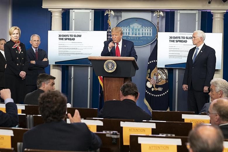 US President Donald Trump at a coronavirus task force news conference at the White House in Washington on Tuesday. Mr Trump's approval ratings are as high as they have ever been, despite what most agree to be his slow performance dealing with the cri