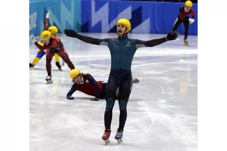 Steven Bradbury of Australia lifting his arms aloft after winning Olympic gold in the 1,000m short track speed skating final in 2002. He skated past the US' Apolo Ohno, Canada's Mathieu Turcotte, South Korean Ahn Hyun-soo and China's Li Jiajun, all o