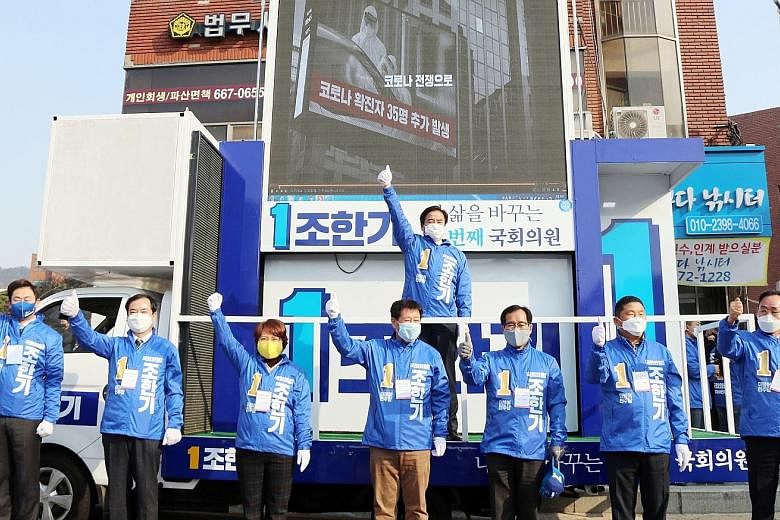 Campaigners for Mr Cho Han-ki of South Korea's ruling Democratic Party seeking citizens' support at a square in Seosan, South Korea, yesterday. PHOTO: EPA-EFE