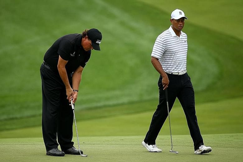 Left: Phil Mickelson will take on Tiger Woods in a one-off golf charity match while the PGA Tour remains on ice. The former will team up with former New England Patriots quarterback Tom Brady (above, left), while Woods will partner another Super Bowl