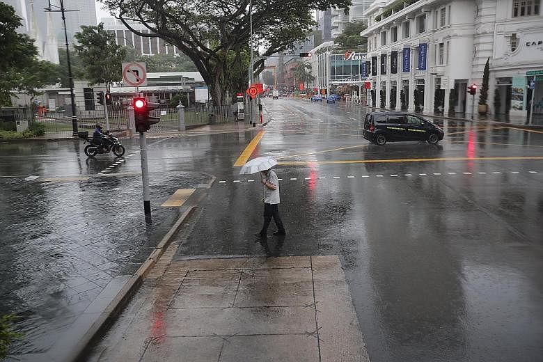 Heavy rain fell in the city area around North Bridge Road at about 10.30am yesterday. The first half of this month is likely to see short thundery showers across many parts of Singapore on most afternoons. The weatherman has said that the warmer-than