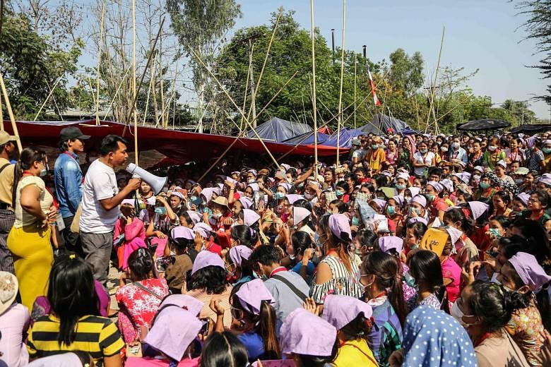 Garment factory workers in Yangon rallying last week to get their jobs back after losing them amid the coronavirus outbreak, which has led to a collapse in demand from Western fashion firms. PHOTO: REUTERS