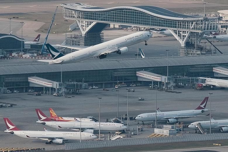 Cathay Pacific will maintain a skeleton long-haul network with two weekly passenger flights from Hong Kong to London, Los Angeles, Vancouver and Sydney, according to the carrier's internal memo. PHOTO: REUTERS