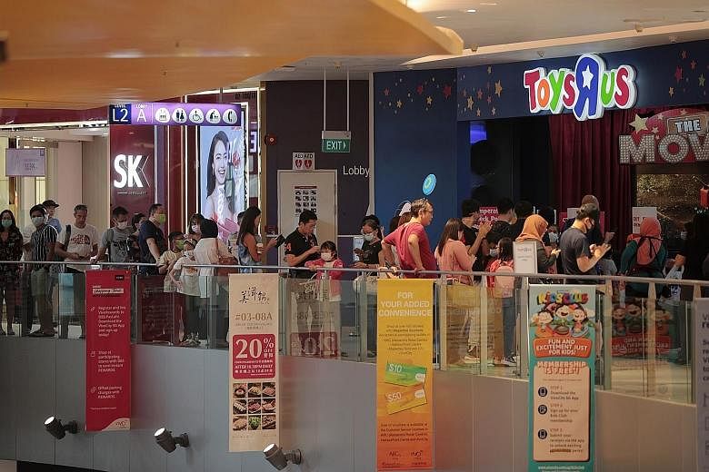 At malls like VivoCity yesterday, queues could be seen outside Toys 'R' Us, Popular and Challenger outlets as parents bought books, toys and laptops to prepare their children for home-based learning from Wednesday.