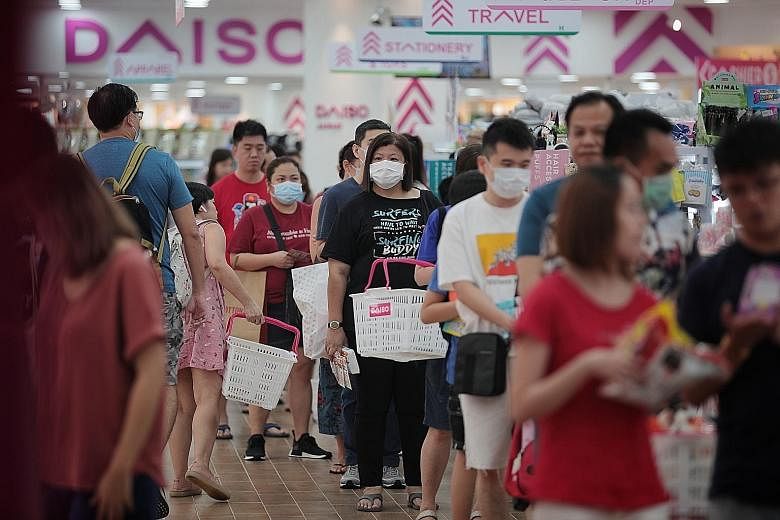At malls like VivoCity yesterday, queues could be seen outside Toys 'R' Us, Popular and Challenger outlets as parents bought books, toys and laptops to prepare their children for home-based learning from Wednesday.