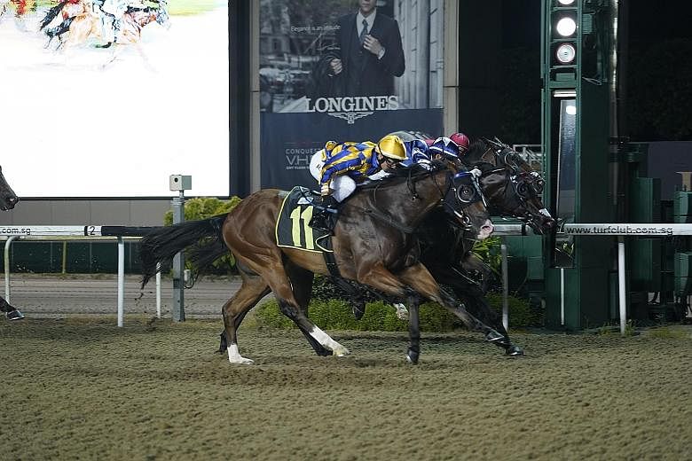 Hugo (No. 11) winning Race 8 at Kranji on Friday, the last night of racing before the virus-enforced suspension. Racing has also stopped in places like Europe, New Zealand, South Africa and Macau. ST PHOTO: DAVE LIM