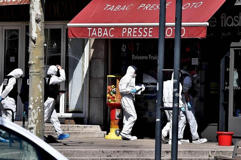 French police officers investigating an alleged terror attack in the town of Romans-sur-Isere last Saturday. The suspect attacked several people with a knife, killing two and injuring five before being arrested.