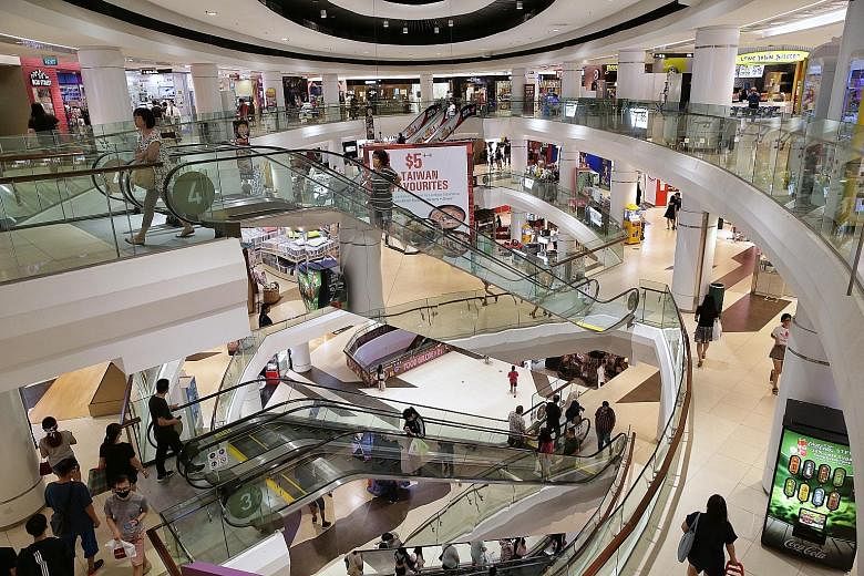 Tampines Mall was not particularly crowded yesterday because of crowd control measures. Beginning today, non-essential services, which include department stores and retail outlets, will be closed for four weeks until May 4 to pre-empt escalating coro