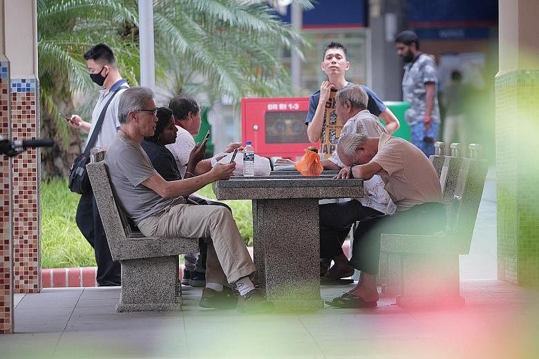 People gathering in Jalan Besar at around 12.30pm yesterday, the first day the circuit-breaker measures took effect. Under the new law, social gatherings with friends and relatives who do not live together are banned, though individuals can still vis