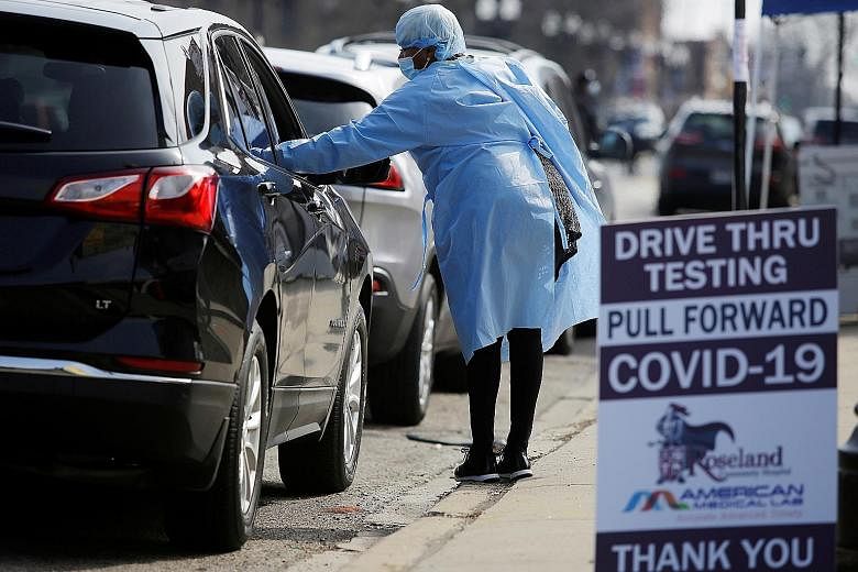 Motorists waiting in line to get tested for Covid-19 in Chicago on Tuesday. A very high portion of infected people are now believed to be asymptomatic, strengthening the argument for everyone to cover their faces while outdoors.