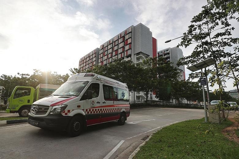 An ambulance yesterday leaving Sungei Tengah Lodge, which is the fourth foreign worker dormitory to be declared an isolation area. The facility is among foreign worker dorms where clusters of Covid-19 infection have emerged.