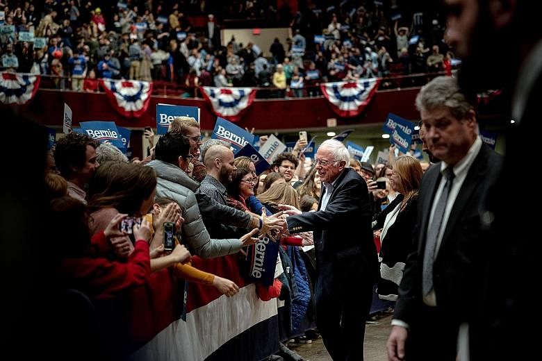 Senator Bernie Sanders greeting supporters at a campaign rally in St Paul, Minnesota, last month. He suspended his presidential campaign this week. PHOTO: NYTIMES