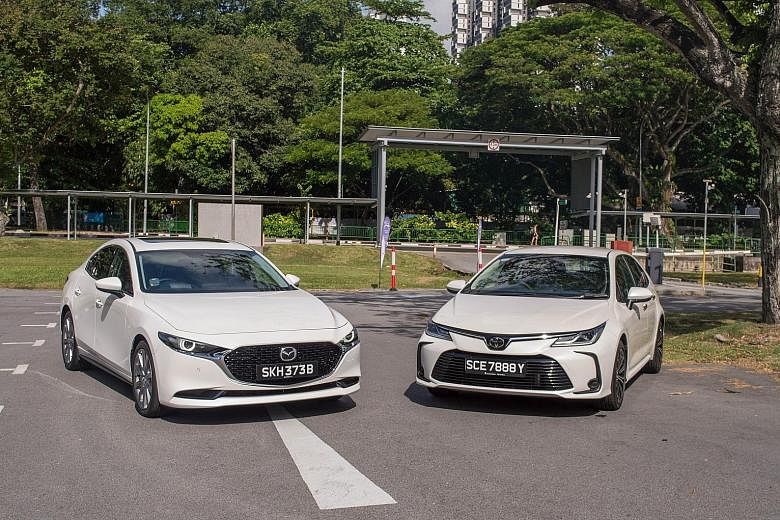The Mazda 3 (left) cuts a sultry silhouette while the Toyota Corolla makes a statement with its trapezoidal grille.