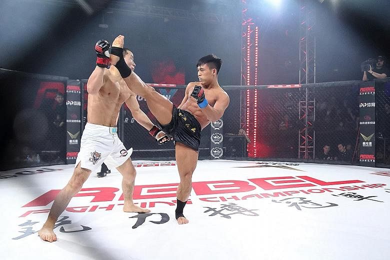 Above: Rebel FC chief executive officer Justin Leong is open to staging a show in Singapore next year. Left: Wang Shuo from China (in black shorts) taking on Aydin Kodekov from Kazakhstan at the Rebel FC 10: The New Order event held in Moscow in Janu