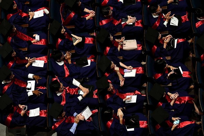 Above: About 7,000 students will be graduating from the National University of Singapore this year and 5,700 from Nanyang Technological University. Left: While job hunting, NTU final-year communications student Elizabeth Lee has decided to pick up ne