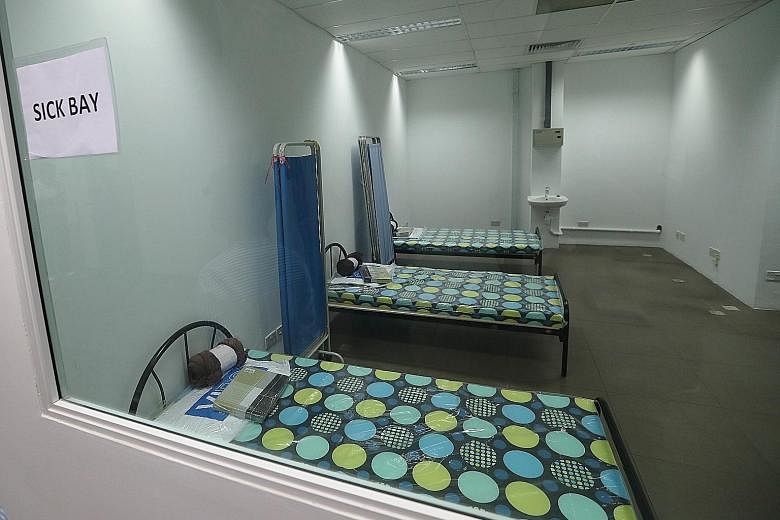 A three-bed room. Meals can be delivered to the cabins to minimise inter-mingling. Two floating accommodation facilities in a restricted area at Tanjong Pagar Terminal yesterday. Each facility can take a few hundred people and be organised to achieve