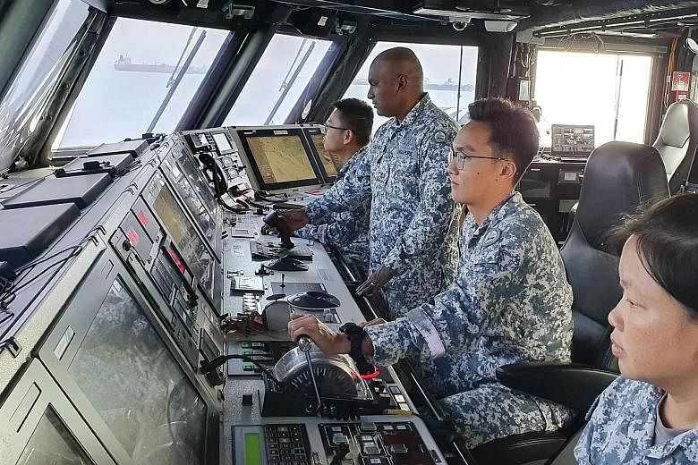 Above: Third Sergeant Nicholas Goh keeping watch as littoral mission vessel RSS Sovereignty conducts patrols in Singapore's waters. Left: Major Jagatheesh Krishnan (second from left) and 3SG Goh (second from right) in the Integrated Command Centre of