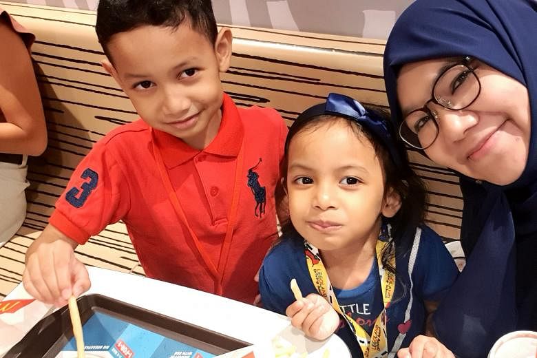 Ustazah Nadia Hanim and her son, eight, and four-year-old daughter. After the religious teacher tested positive for the coronavirus on March 13, she said her biggest fear was her children getting infected.