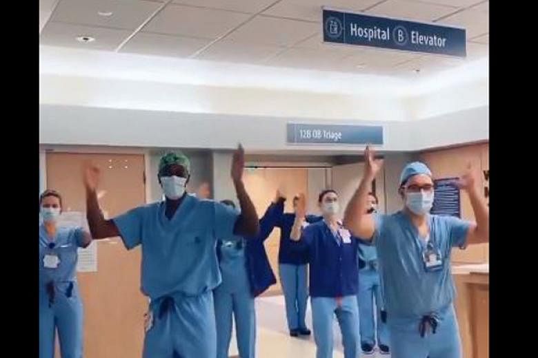 Dr Jason Campbell (front, at left) has taken the Internet by storm with clips featuring him and colleagues doing the ‘corona foot shake’, ‘the cha-cha slide’ and other dance moves.