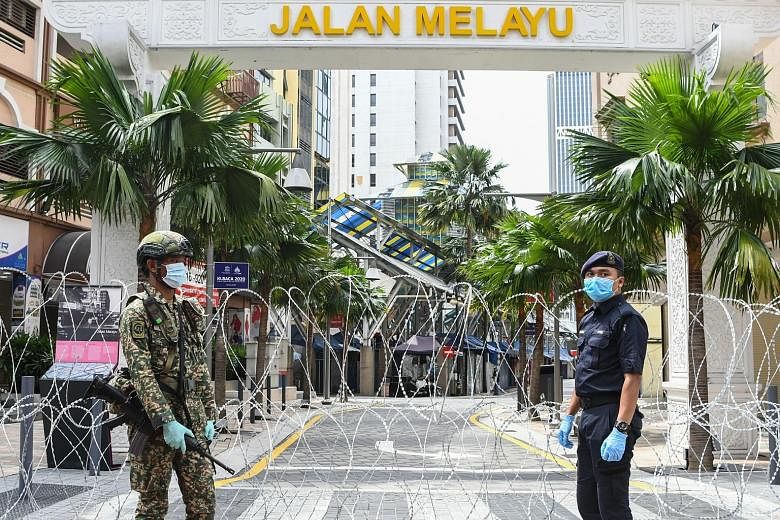 Barbed wire fences have gone up in the Jalan Masjid India district after more than 40 people in the area tested positive for Covid-19.
