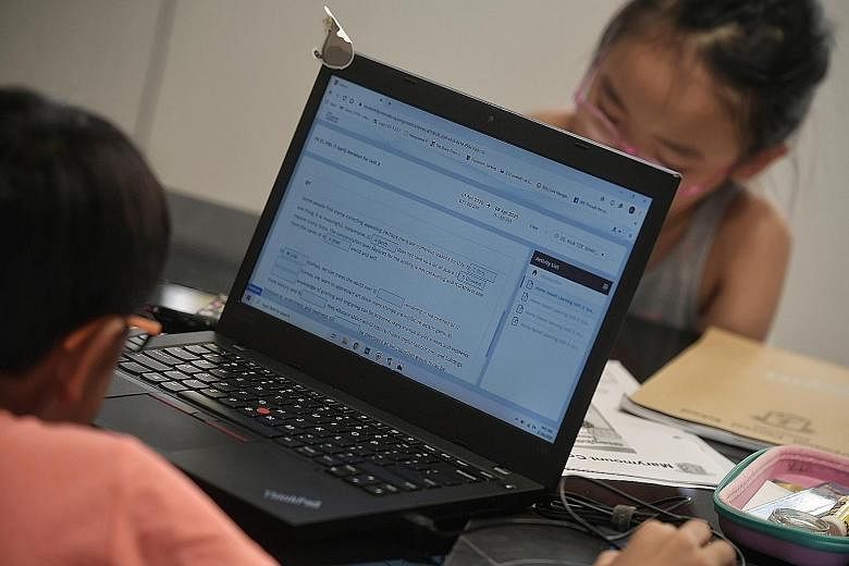 Children studying at home earlier this month. StarHub's Internet service faced intermittent outage issues yesterday, causing disruption to users working and studying at home during a period when connections are crucial amid the coronavirus outbreak.