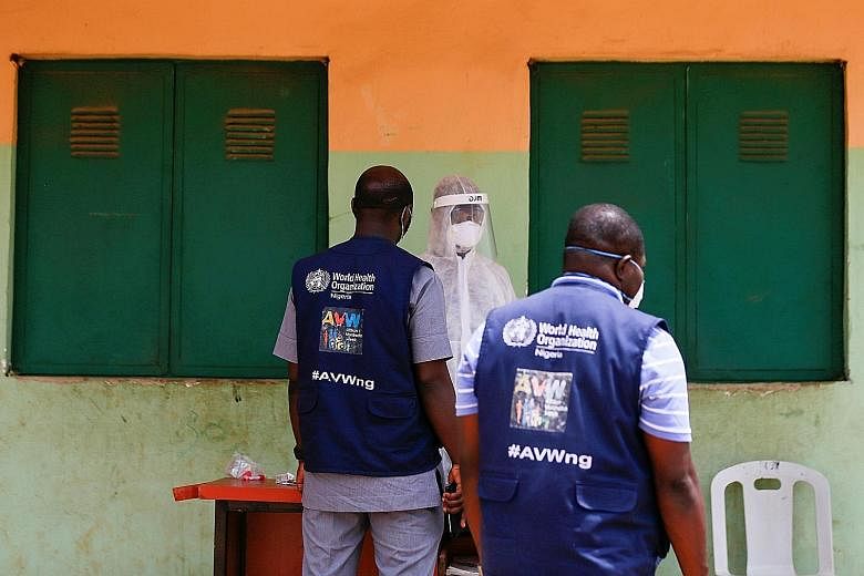 World Health Organisation (WHO) officials at a community testing for the coronavirus in Abuja, Nigeria. Washington believes it still has the power to rearrange the terms of the older institutions, such as the WHO, but success across the board is cert