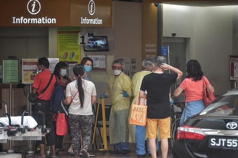 The Emergency Department at Tan Tock Seng Hospital yesterday. While facilities and manpower are still coping, they are starting to feel the strain. All three experts said what is needed is a good system for isolating and monitoring Covid-19 patients 