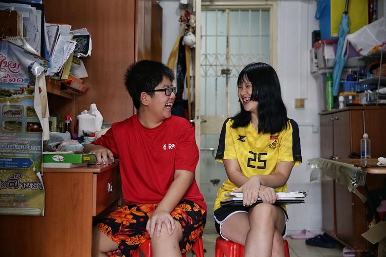 Polytechnic student Loh Miao Xin, seen here with her brother Khim San at their home in Bedok, had shared that her mother was out of a job because of the outbreak. The family plans to donate about $5,000 to The Straits Times School Pocket Money Fund. 