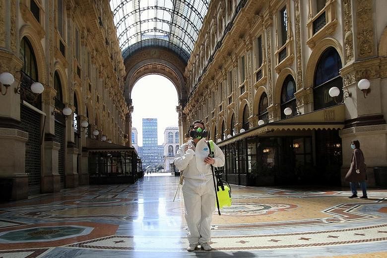 A worker in charge of disinfection at the Vittorio Emanuele Gallery in Milan on Friday. In the 30 days to April 16, the growth rate of new Covid-19 cases in Milan was 30 per cent higher than the national level. PHOTO: EPA-EFE