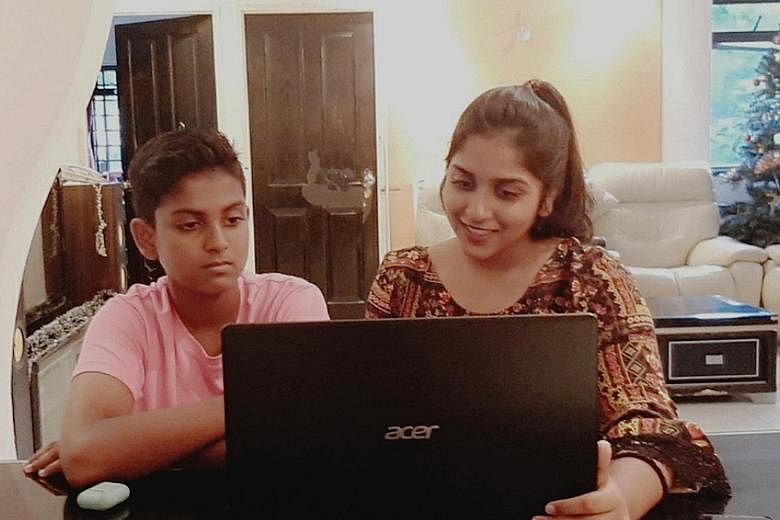 Sheryl Shivani, with her brother Gerald Giresh Raj, says she can complete her online assignments faster now that she has a laptop. In the past, she relied on her mobile phone, which could not support all the features she needed for e-learning.