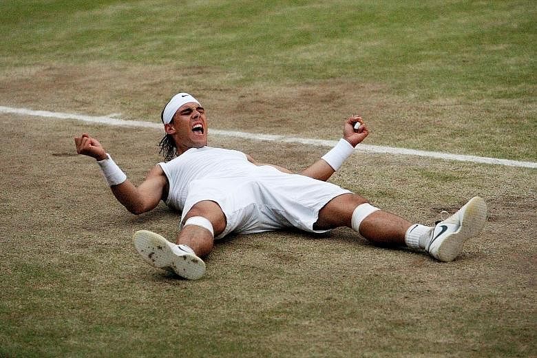 Rafael Nadal celebrating after defeating his old rival Roger Federer in the 2008 Wimbledon final. It was the first time the Spaniard had won the grass-court Grand Slam. PHOTO: REUTERS