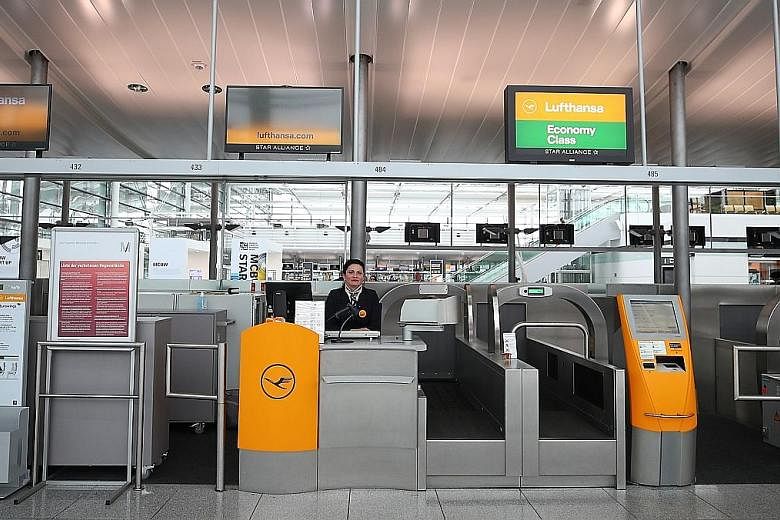 Empty Lufthansa ticket counters at Munich's international airport last month. The carrier has lost 95 per cent of its passengers amid the coronavirus crisis and is looking for help from the German government. Its plight is shared by other carriers in