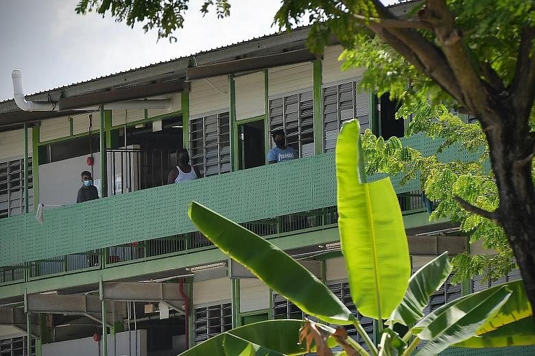 Changi Lodge II was one of five new coronavirus clusters detected on Sunday. Of yesterday's 1,426 new coronavirus cases, 1,369 were work permit holders living in dormitories. ST PHOTO: JOEL CHAN Woodlands Lodge I was one of the foreign worker dormito