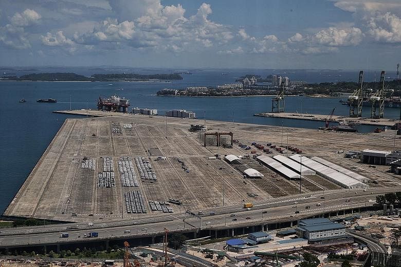 Marquees being set up (left) near rows of cars (above) at the Tanjong Pagar Terminal site on Wednesday. Trucks carrying building materials could also be seen entering the terminal, which has been vacant since port operations were relocated to Pasir P